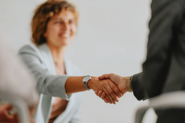 Professional Business Handshake Between Two People in Office