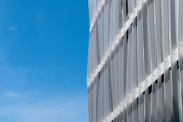 istock Low angle view of modern office buildings against clear sky 2160997128