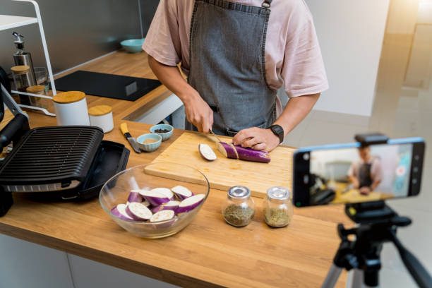 istock The chef is broadcasting live from workshop how to prepare a grilled eggplants with garlic 2160997175