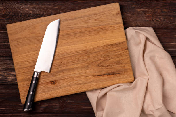 istock Big kitchen knife laying on a cutting board 2161002591