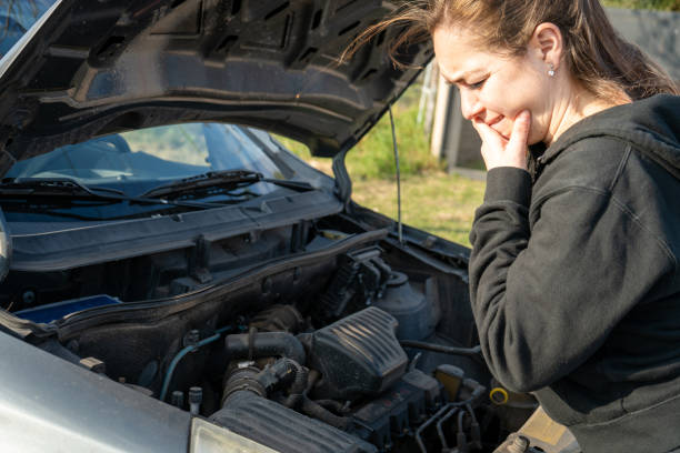 istock Young woman sad because her car broke down 2161003093