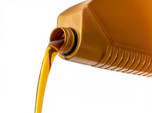 istock Pouring Motor Oil from Plastic Bottle with Copy Space 2161005104
