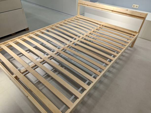istock Wooden Slat Bed Frame in Showroom 2161005184