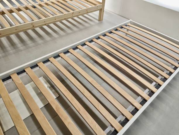 istock Wooden Slat Bed Frame in Showroom 2161005185