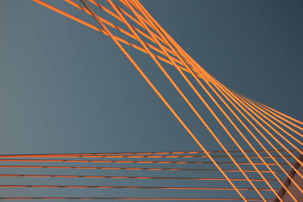 istock Pink and yellow lines against blue sky. Background 2161006563