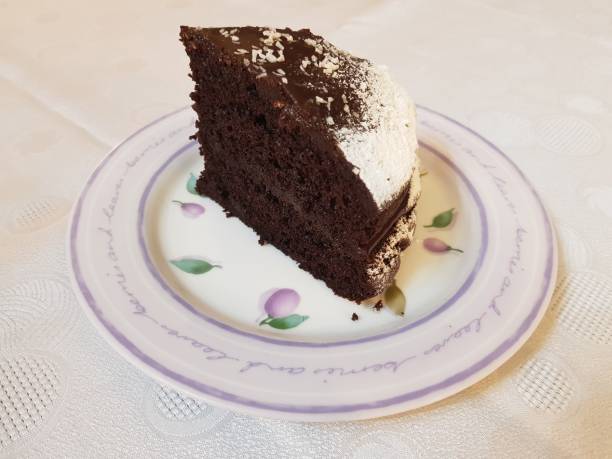 istock A slice of Chocolate Cake dusted with sugar and sprinkled with grated coconut 2161006645