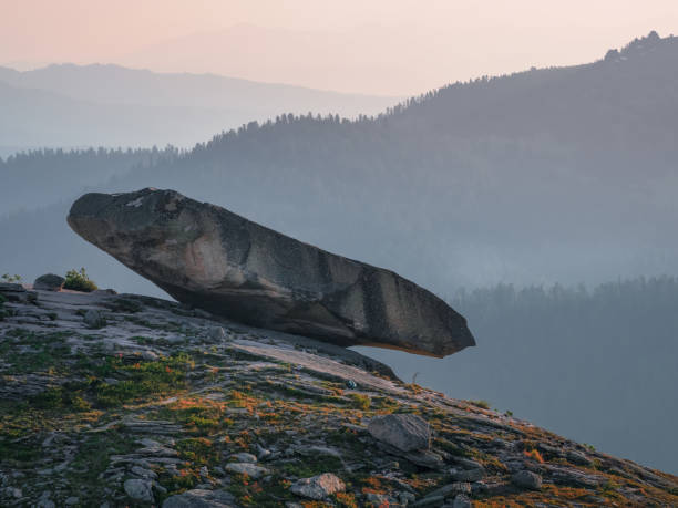 The Hanging Stone at sunset. Ergaki Natural Park. Siberia. The Hanging Stone at sunset. This is one of the main natural attractions in the Ergaki Natural Park. Siberia. hanging stone stock pictures, royalty-free photos & images