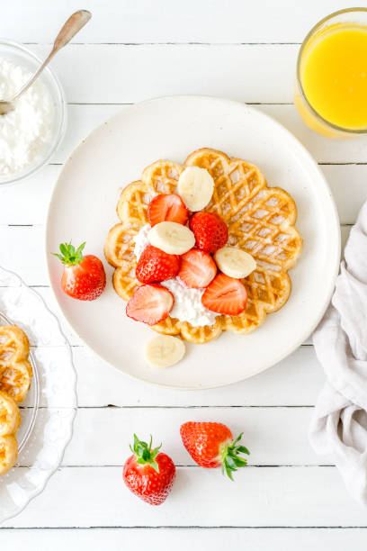 istock Breakfast with heart waffles, strawberries and banana 2161008297