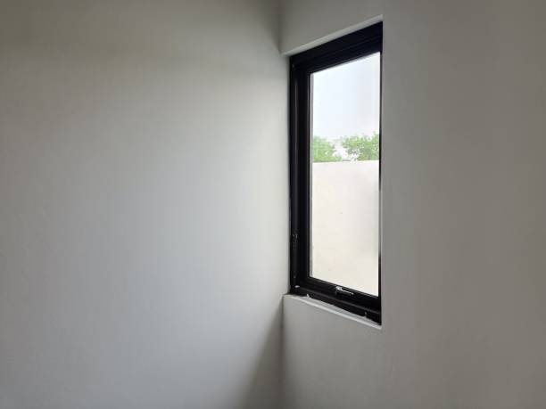 istock window in the corner of the room 2161011419