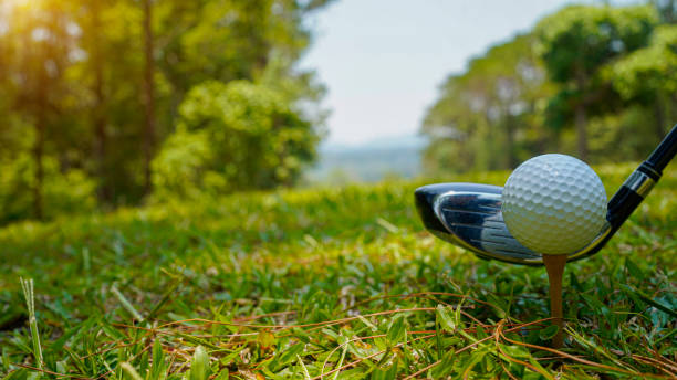 istock Golf balls on the golf course with golf clubs ready for golf in the first short. 2161015836