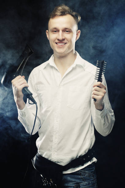istock young t hairstylist looking at camera 2161021002