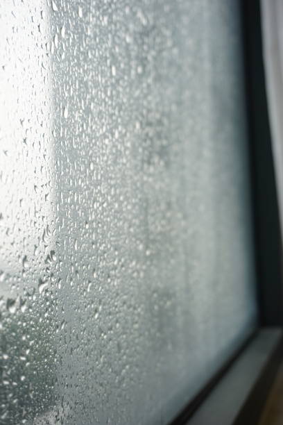 istock Dark and moody windowsill during heavy rain background 2161022391