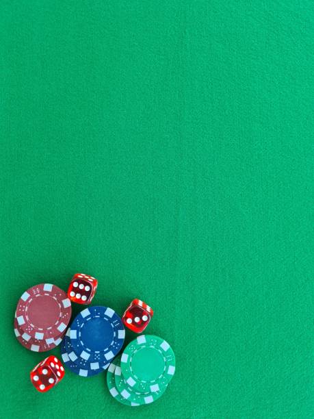 istock Red Dice and Poker Chips on a Green Felt Tabletop 2161023171