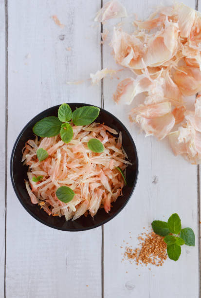 Delicious and fresh pink pomelo salad with crushed peanuts
