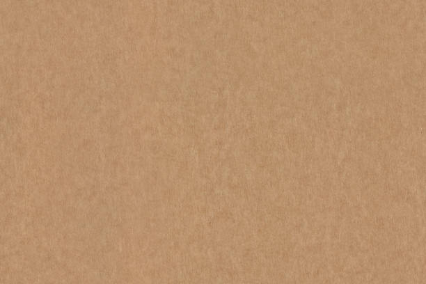 istock Light brown color smooth recycled cardboard kraft paper, seamless tileable texture, image width 20cm 2161025861