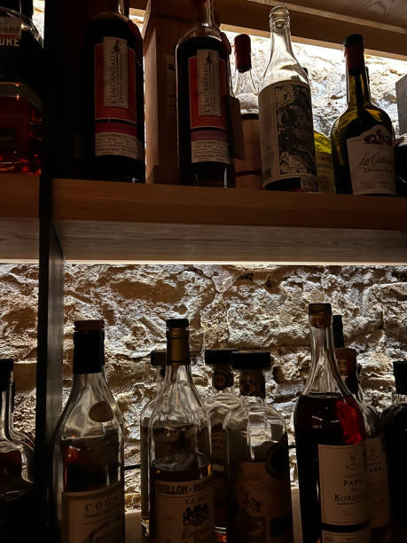 istock Bar Shelf with Bottles and Lighting 2161026398