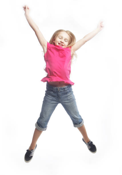istock girl jumps on a white background 2161030166