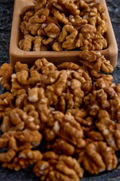 Detailed macro image of a walnut, showcasing its natural texture and patterns. Perfect for food blogs, healthy recipes, organic visuals, and nutrition-focused content