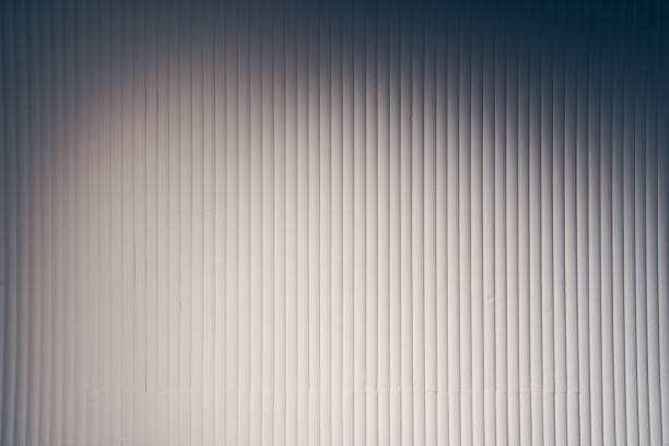 The concrete texture with darkening on the sides with a subtle ripple effect gives the surface a unique and dynamic look. Vertical stripes with space to copy. High quality photo