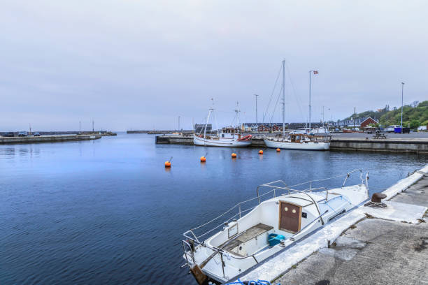 istock Sea pier with boats on a cloudy day 2161035275