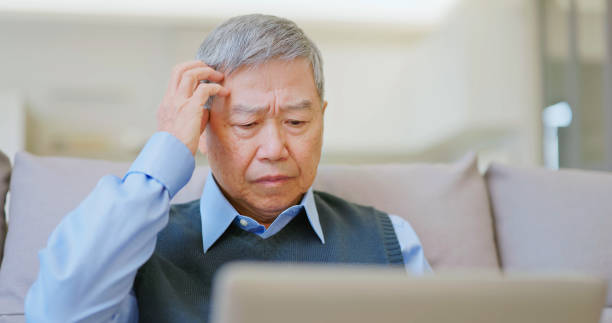 istock asian elderly laptop being scammed 2161035884