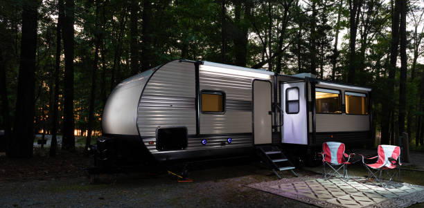 istock Glamping in a morning forest with lake behind 2161037181