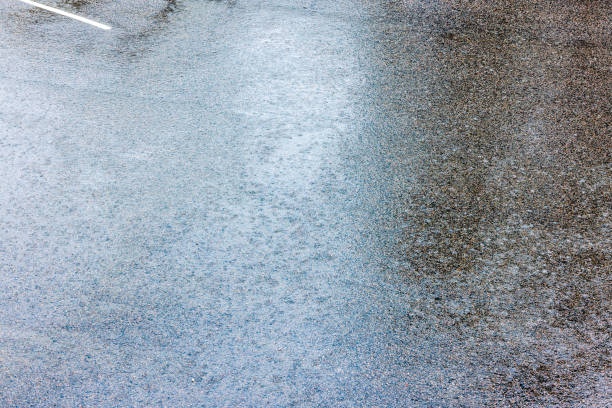 Close-up view of asphalt during heavy rain.