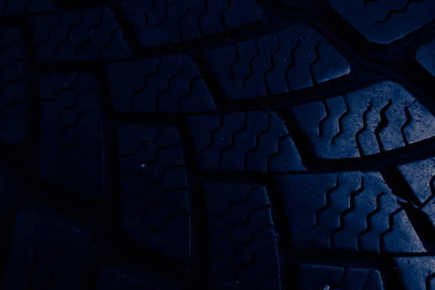 istock tire tread, tire traces background in blue 2161039125