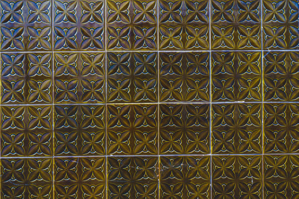 Ceramic square tiles with small ornamental mosaic pieces. Old tiles abstract pattern, background