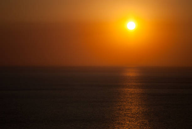 istock Evening sunset on the horizon into the sea. 2161040072