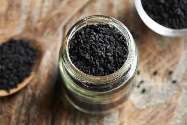 istock Black cumin or Nigella sativa seeds in a glass jar 2161042768