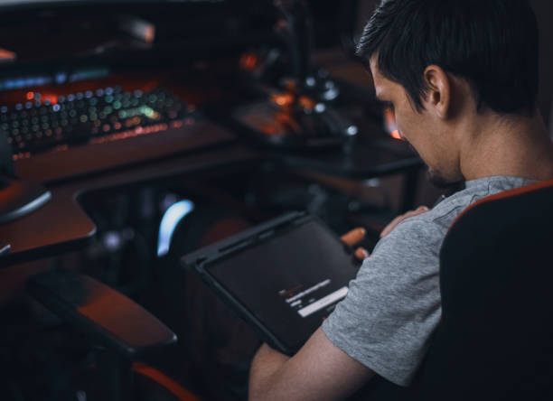 istock A young caucasian guy sits in a work chair and browses an online menu for ordering takeaway food 2161043054