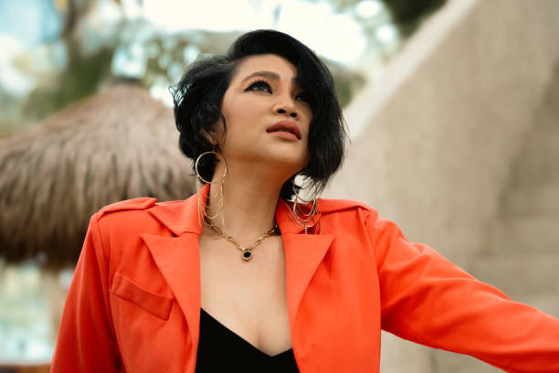 istock Female model in a red suit. 2161046704