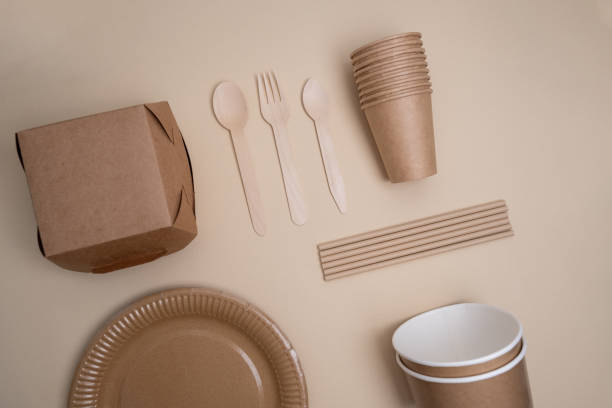 istock Kraft paper tableware: cups, food boxes, isolated on a light background. A set of various disposable tableware. Recycling and zero waste concept. Mock up 2161055047