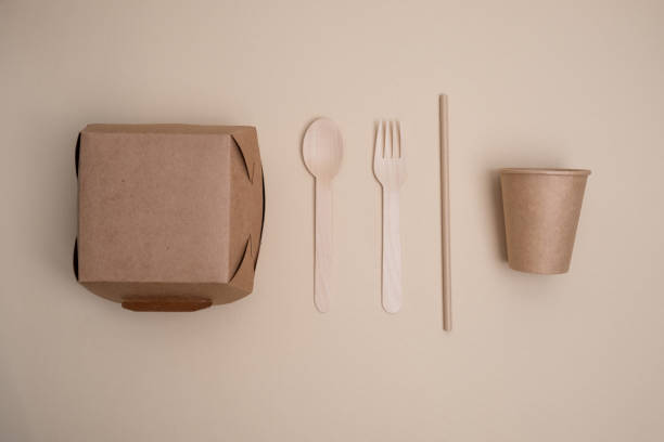 istock Kraft paper tableware: cups, food boxes, isolated on a light background. A set of various disposable tableware. Recycling and zero waste concept. Mock up 2161055049