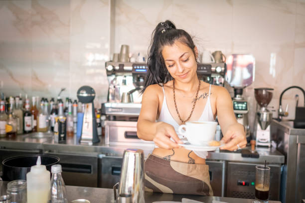 istock Busy female barista making cappuccino 2161056958