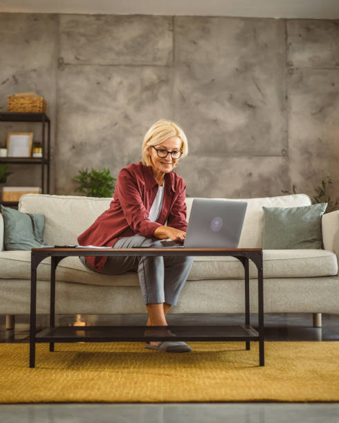 istock Mature senior woman work from home on laptop 2161058788