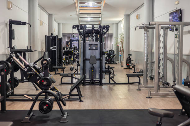 istock Wide Shot of a Gym Featuring Various Machines for Strength Training Routine 2161059255