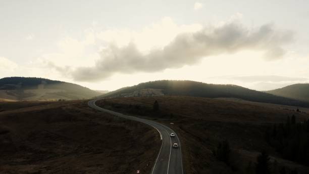 istock Mountain Road Winding Through Tranquil Hills at Dusk 2161066106