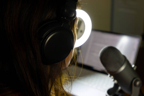 istock Woman recording a podcast with a microphone 2161066832
