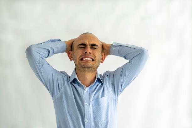 istock Stressed, desperate and distressed man with his hands on his head feeling a bad headache 2161067170