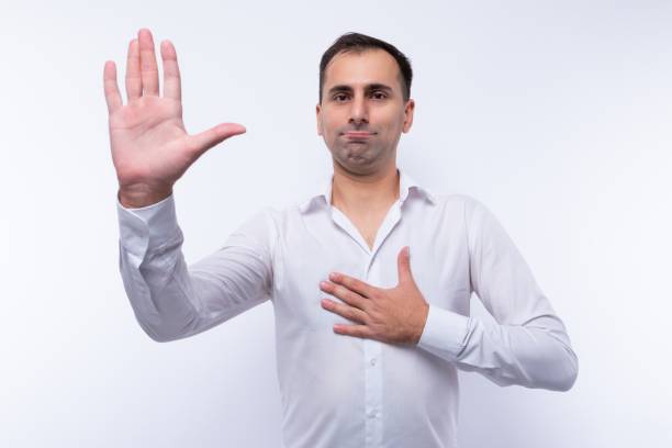 istock European 40 year old man dressed in shirt greets and waves 2161069395