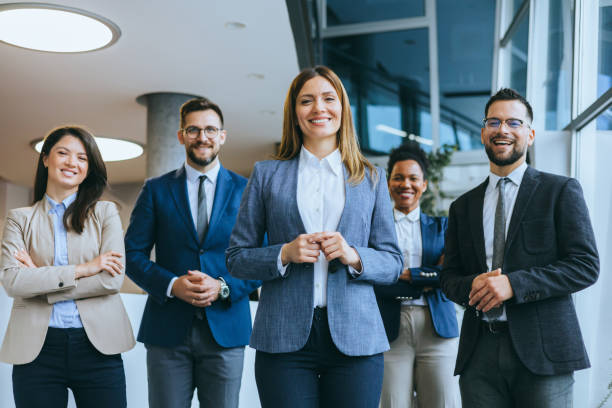 Business team with female leader smiling