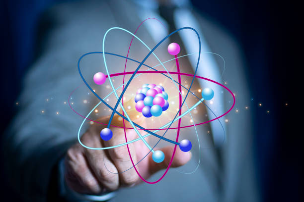 istock Bussinessman hand holding creative atom on blue background. Nuclear fusion concept, endless energy, cheap electricity, future technologies. Science and future concept 2161073618