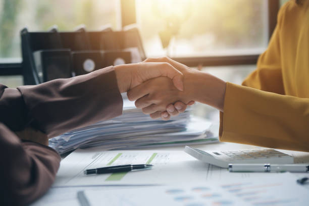 istock Teamwork executives colleagues business people handshake after meeting 2161073909