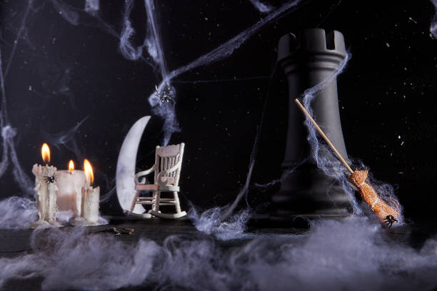 Create a hauntingly enchanting Halloween atmosphere with this captivating scene, featuring a dark chess rook, a white rocking chair, a metallic moon, and flickering candles