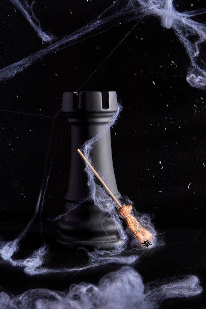 This mesmerizing Halloween setup features a dark chess rook, a white rocking chair, a metallic moon, and flickering candles, all enveloped in a shadowy ambiance.