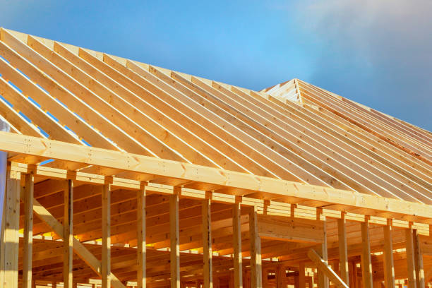 istock Currently under construction, a new frame building with rafters, roof beams, construction framework 2161080277