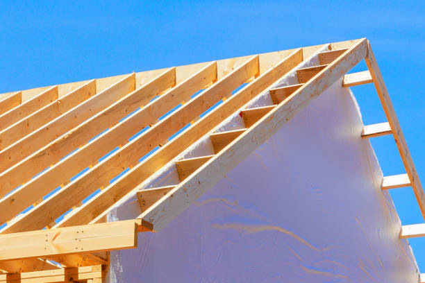 istock Construction framework for a new framed building with rafters roof beams is currently being constructed 2161080583