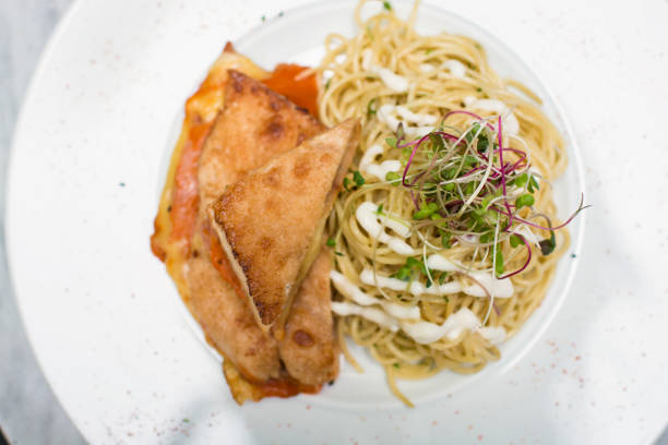 Meal spaghetti with chicken filet milanese breaded meat and pasta